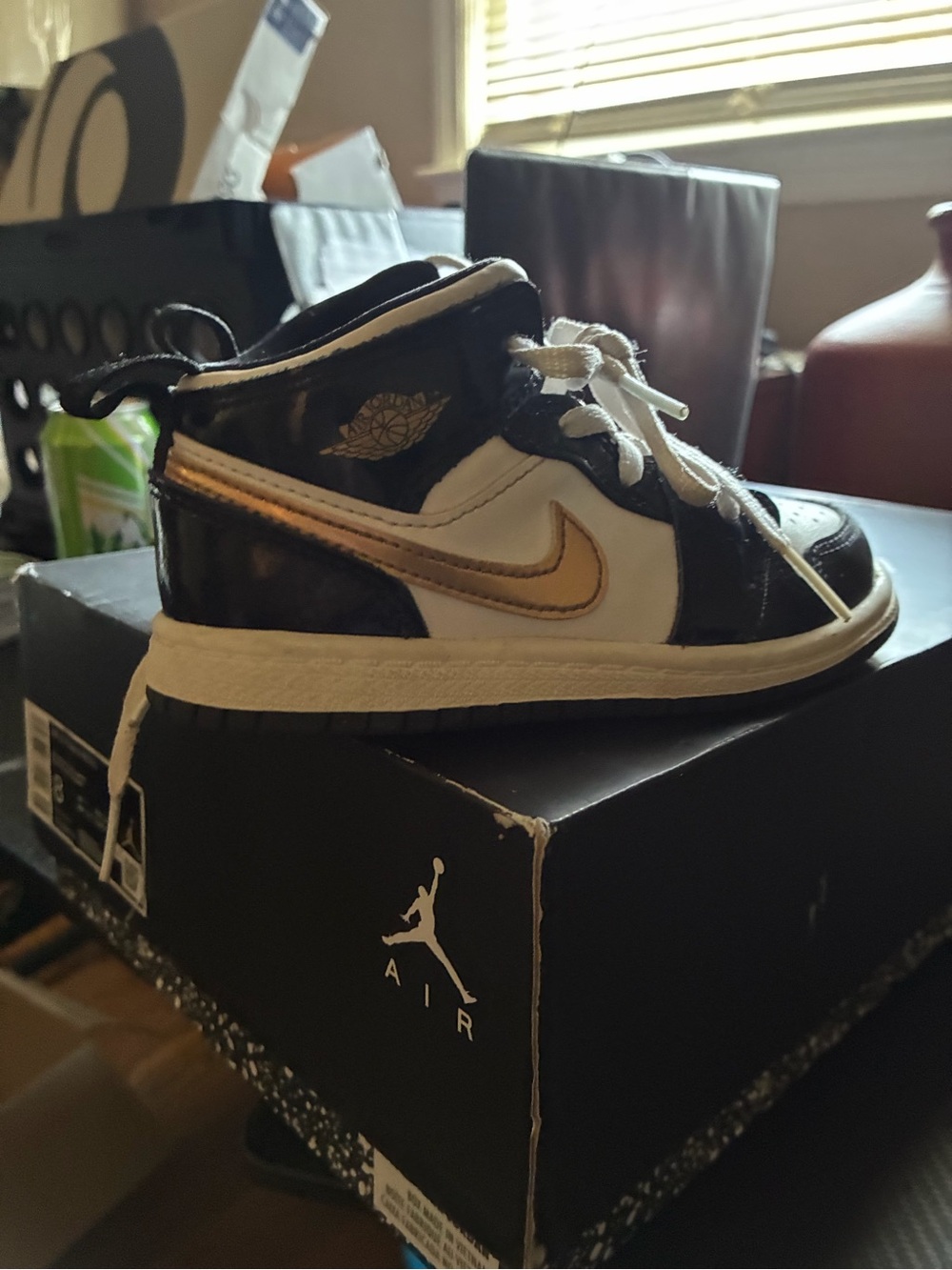 Jordan Kids Black, White and Gold High-Top Sneakers